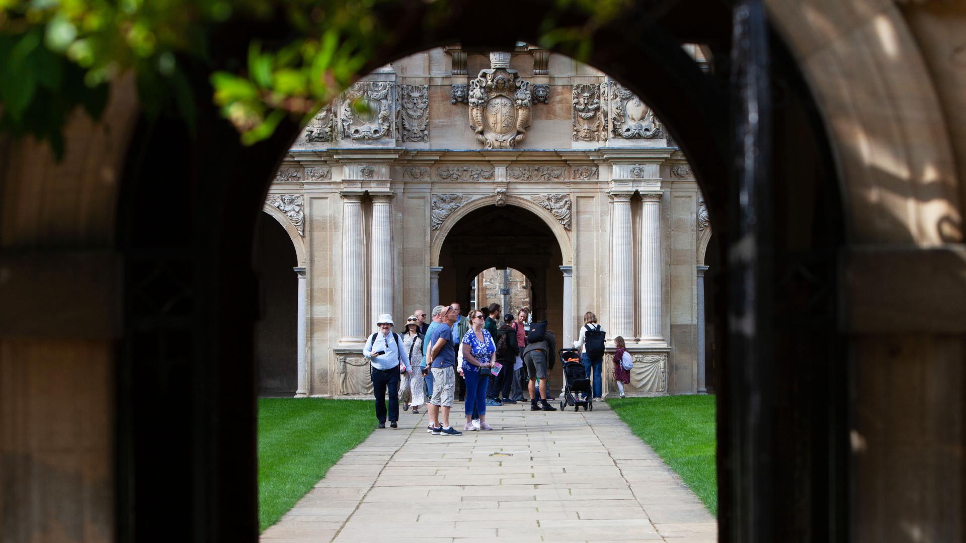 St John's College quad viewed through a stone archway