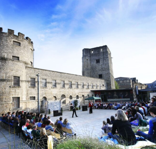 People attending the Oxford Shakespeare Festival at Oxford Castle