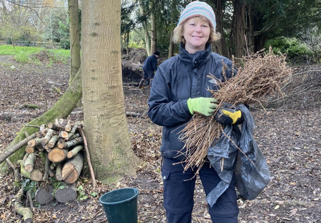 Volunteer holding branches